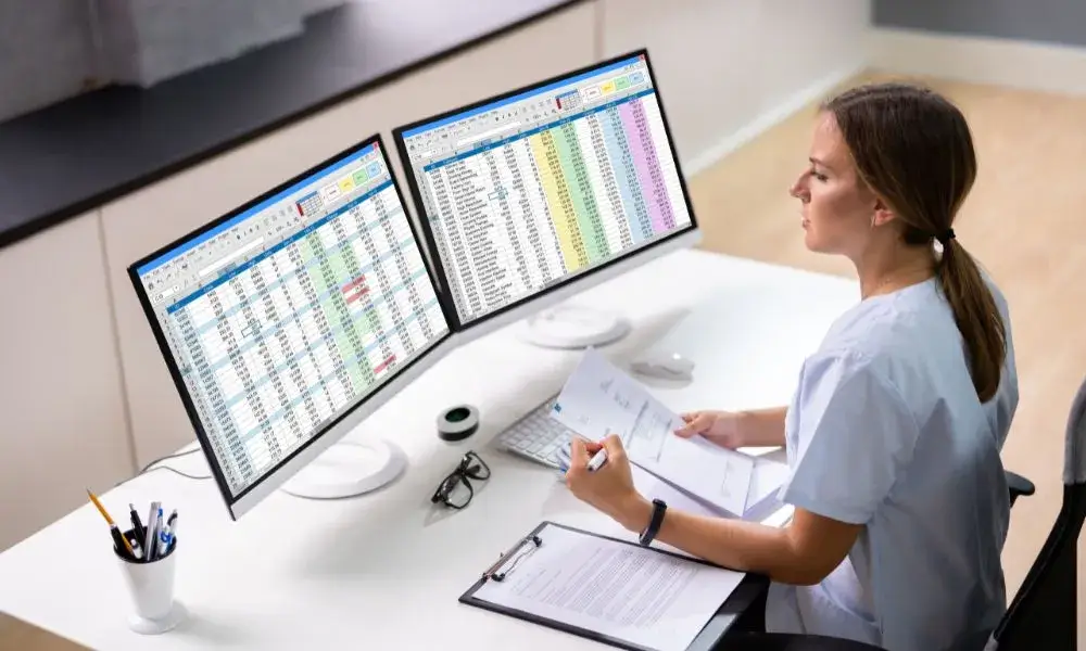 Maniba_RCM_Home_Page_A_Lady_Working_in_Excel_On_Computer_Banner