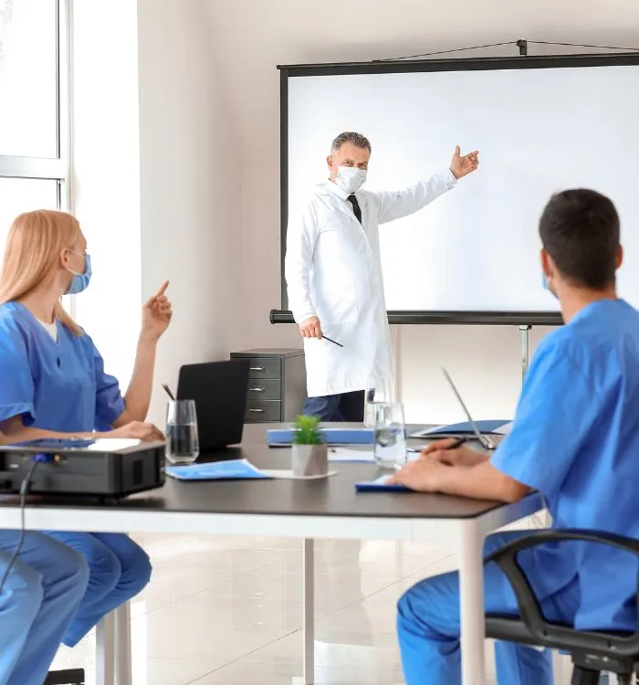 Maniba_RCM_Home_Page_Group_Of_Doctor_Taking_Training